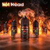 美國進口 Hot Head 暴脾氣尼古丁鹽煙油主圖。背景為燃燒的火焰與煙霧，襯托中央的草莓口味 (Strawberry) 30mL 瓶身。強調其 38mg 高濃度帶來的強勁擊喉感與全系列豐富口味。
